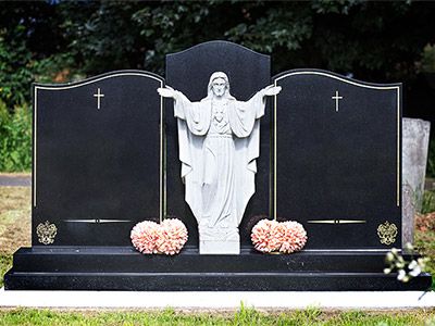 double headstone with sculpture